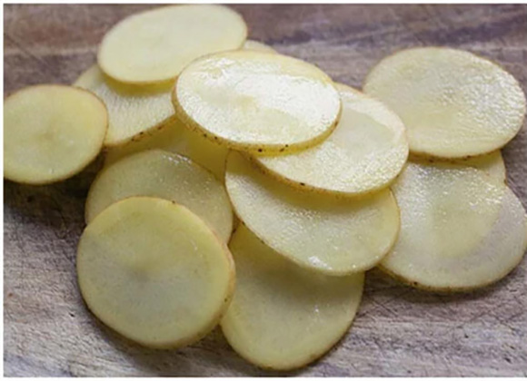 potato slices cut by small potato chips cutter